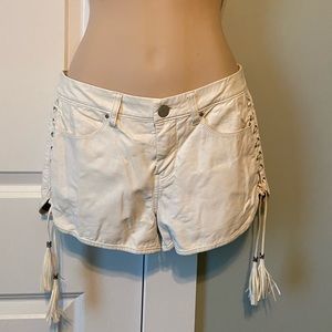 White faux leather shorts
